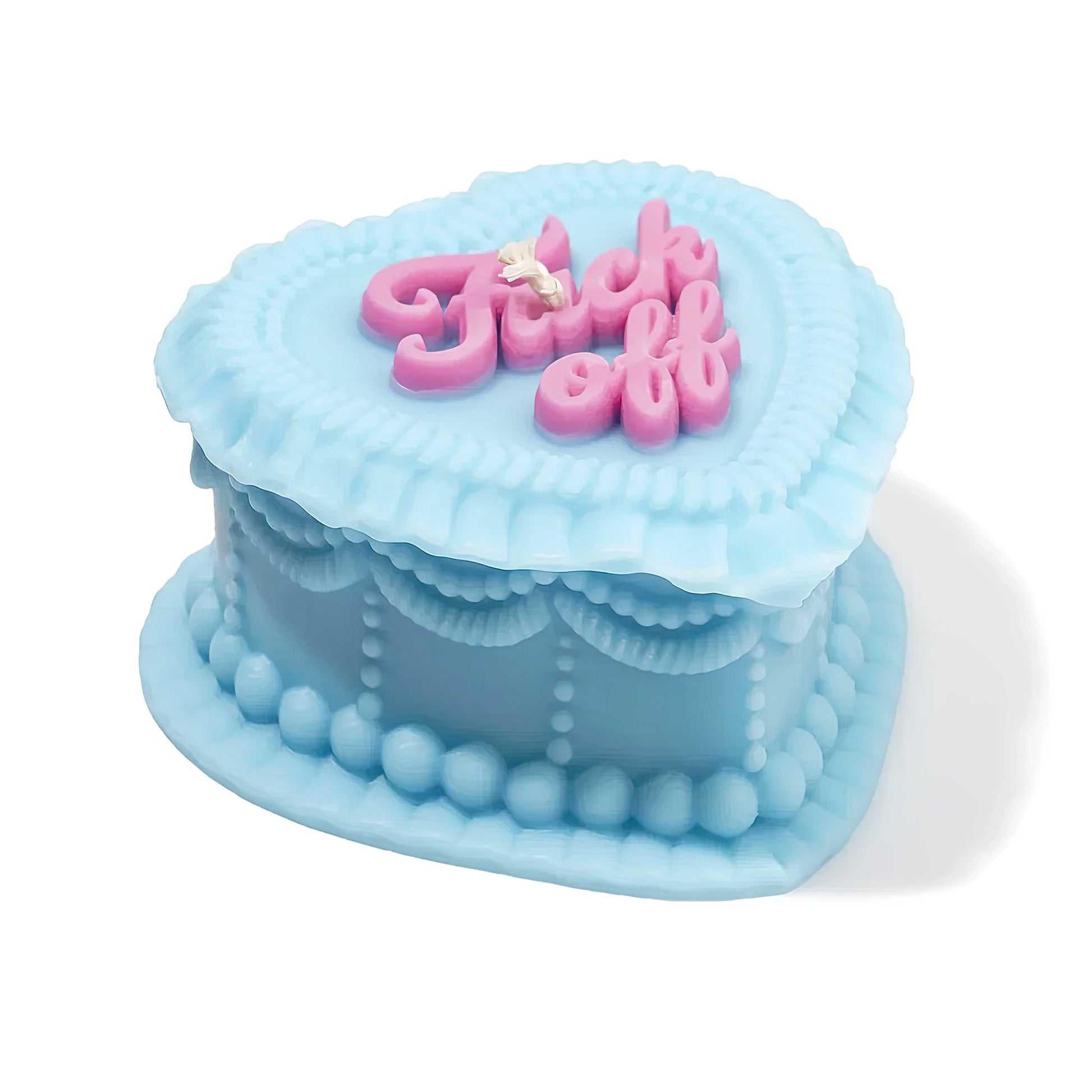 Blue fuck off gift candle shaped like a cake with pink text on a white background